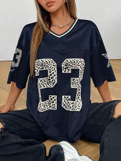 Savanna | Women’s Oversized V Neck Short Sleeve Animal Print Top 12