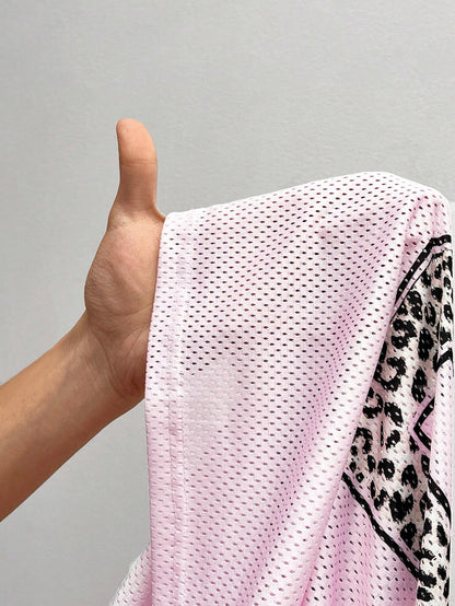 Savanna | Women’s Oversized V Neck Short Sleeve Animal Print Top 9
